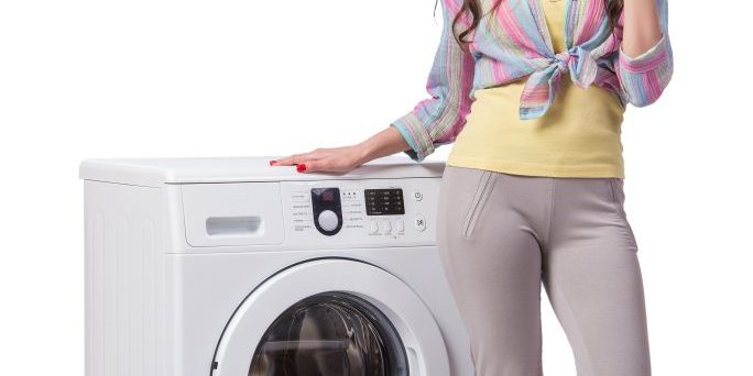 Woman tired after doing laundry isolated on white Woman tired after doing laundry isolated on white